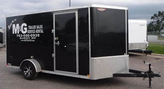 black enclosed trailer with white rental decal