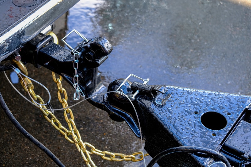Trailer Coupler with chains after rainfall.